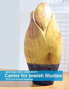2013-2014 Jewish Studies annual report cover, with photo ofblonde wood sculpture with a dark metal base, evoking a sprouting seed. Student artwork called "Seed".